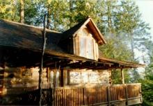 Log house with shake roof